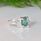 Raw Emerald and diamond engagement ring in solid sterling silver with a nature-inspired design.