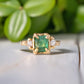 Raw emerald and diamond engagement ring in solid 14k gold, featuring mint green emerald and conflict-free diamonds.