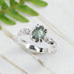 Raw Montana Sapphire silver ring with organic band, showcasing teal blue-green gemstone, perfect for unique engagement.