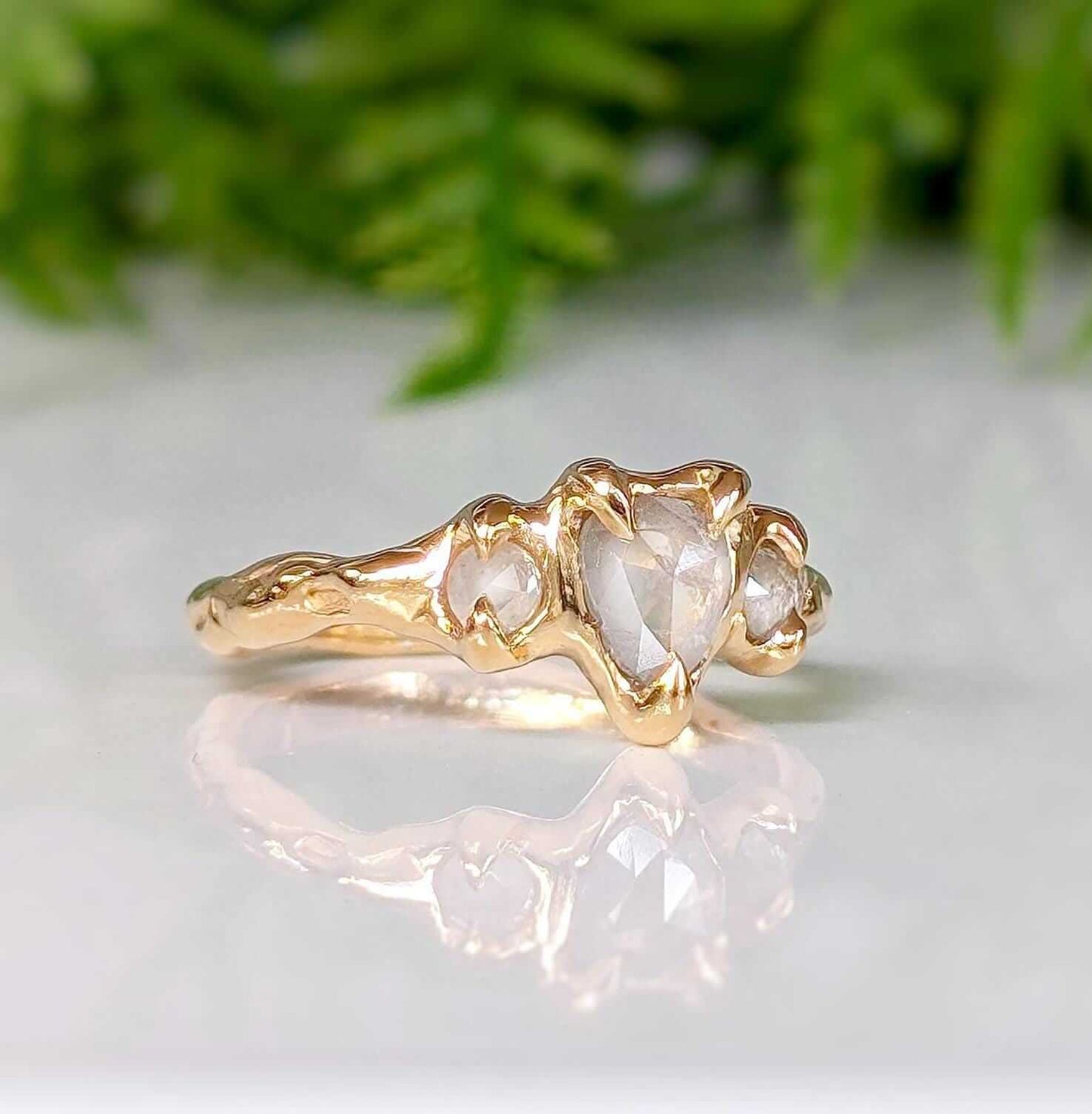 Rustic solid gold diamond engagement ring featuring Salt & Pepper diamonds on a textured band.