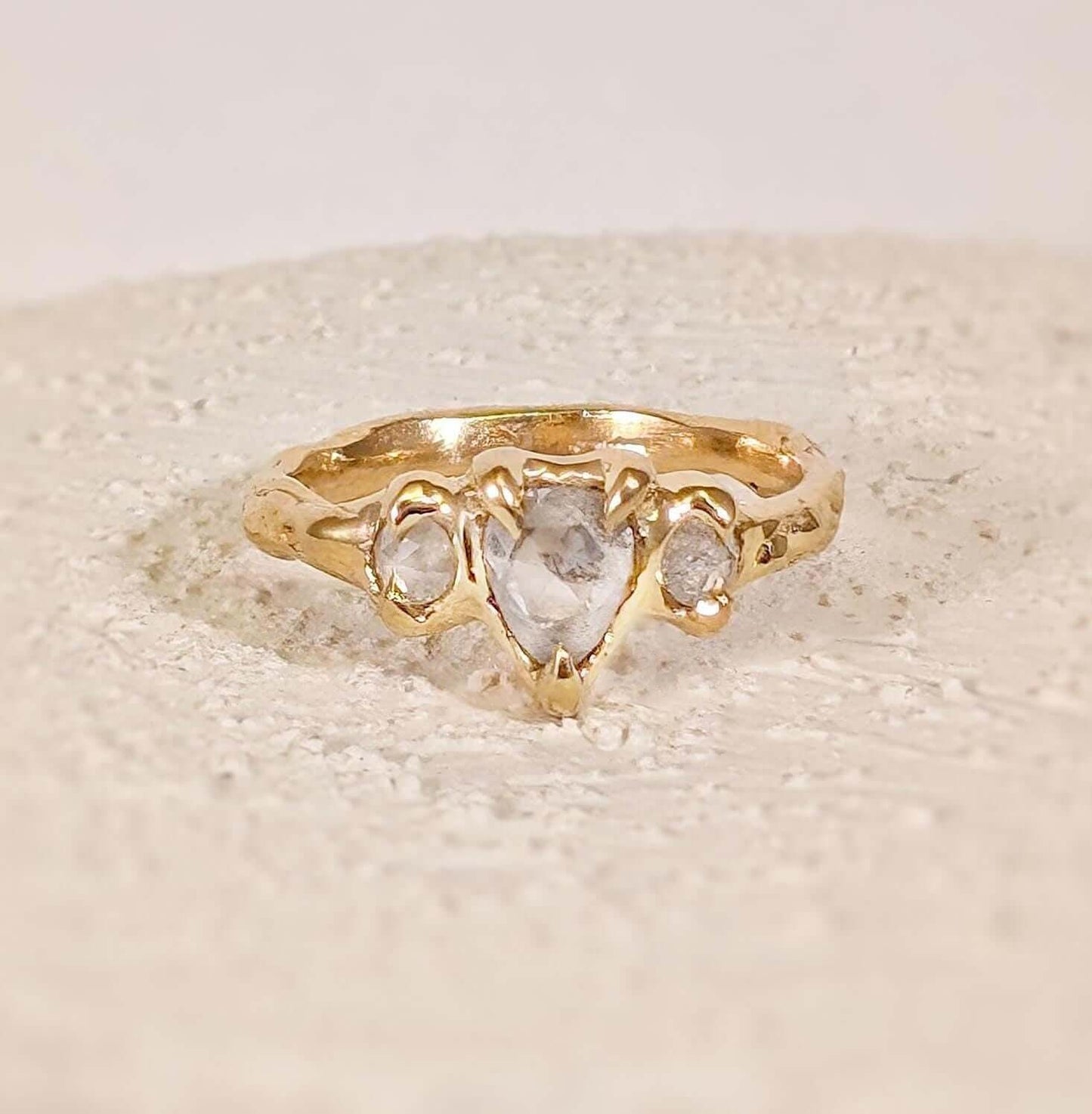 Rustic Solid Gold engagement ring with three unique Salt & Pepper diamonds perfectly set for a loved one.