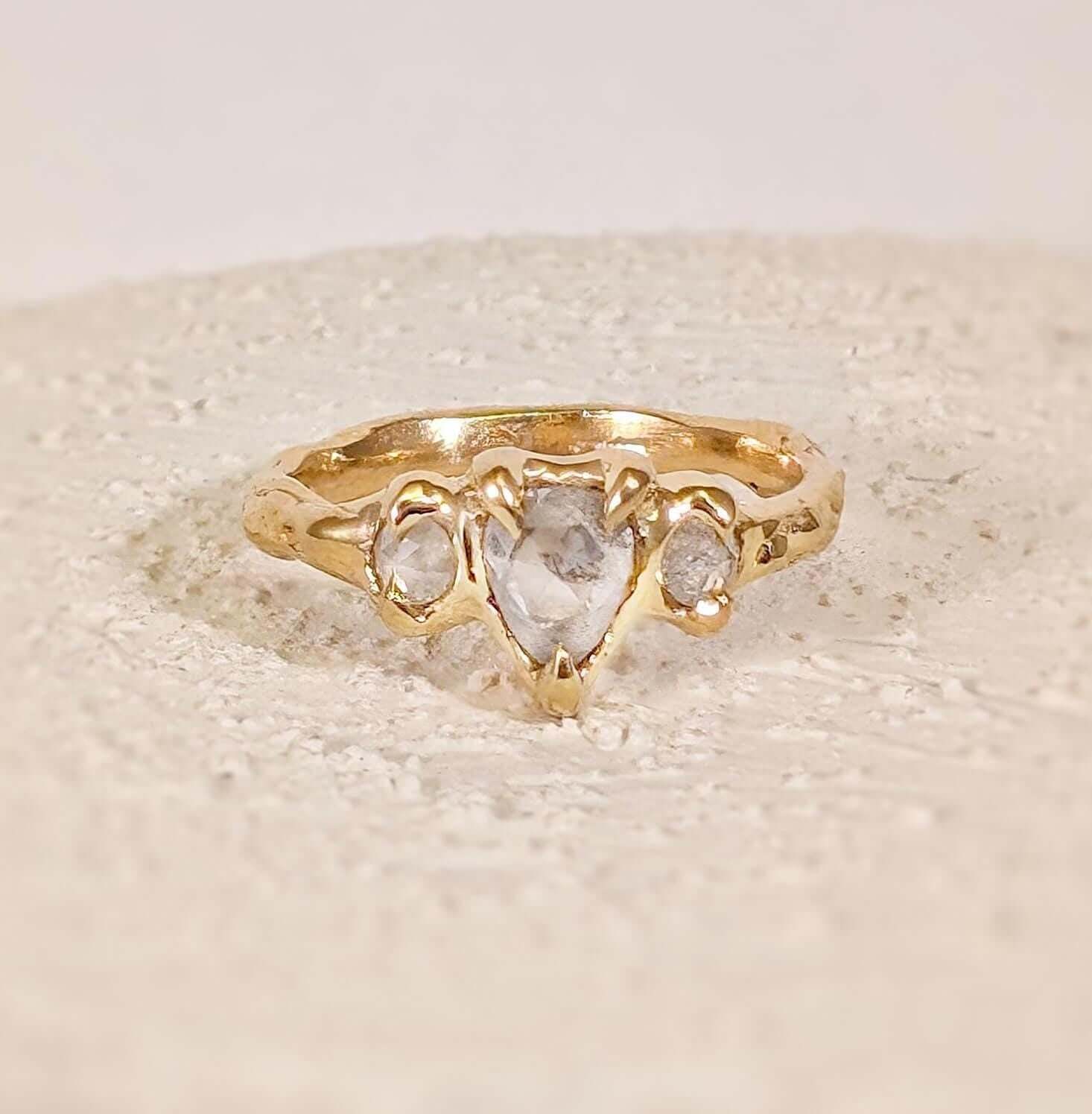 Rustic Solid Gold engagement ring with three unique Salt & Pepper diamonds perfectly set for a loved one.