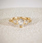 Rustic solid gold engagement ring featuring three Salt & Pepper diamonds set on a textured band.