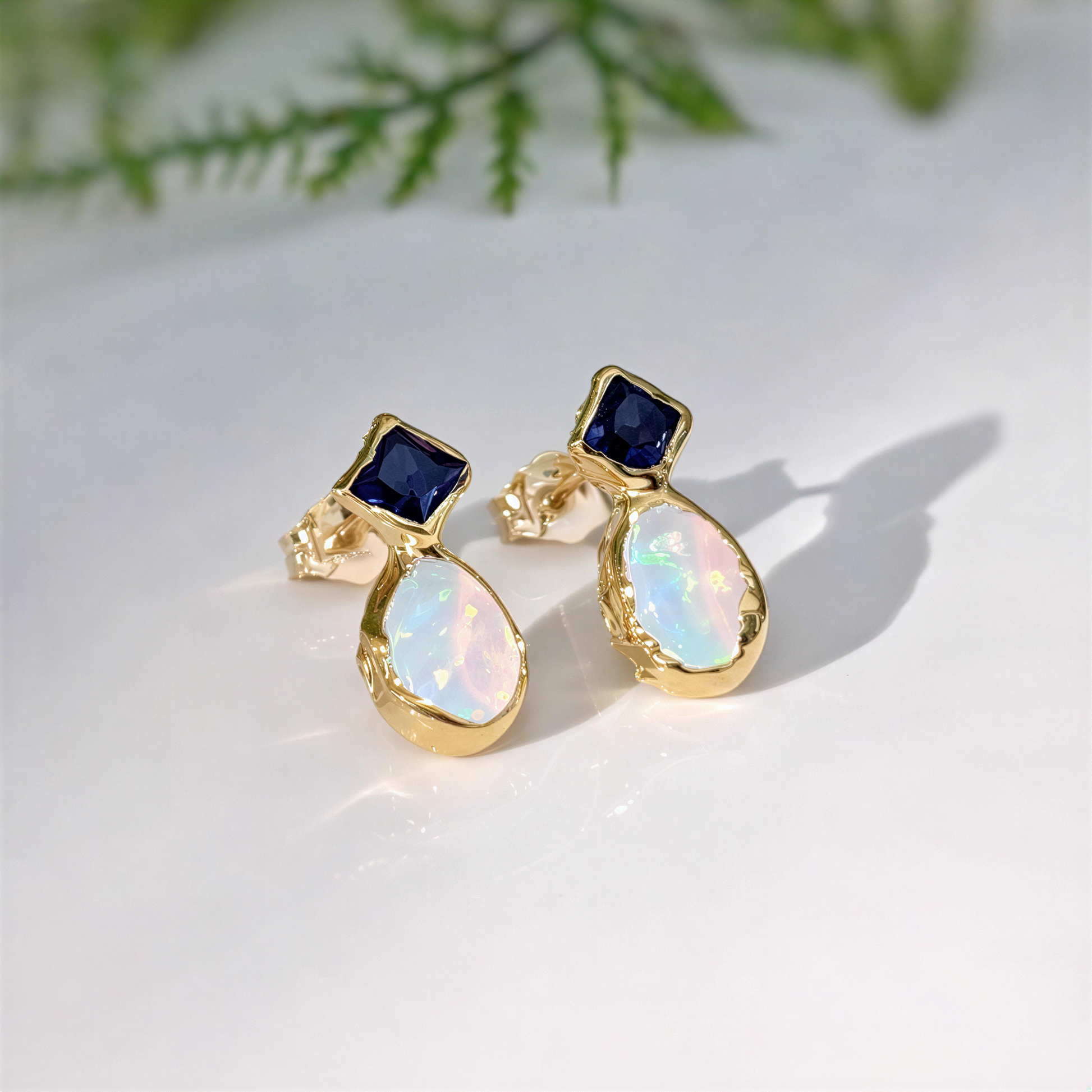 Blue Sapphire and Opal stud earrings in Gold featuring rustic and elegant gold design