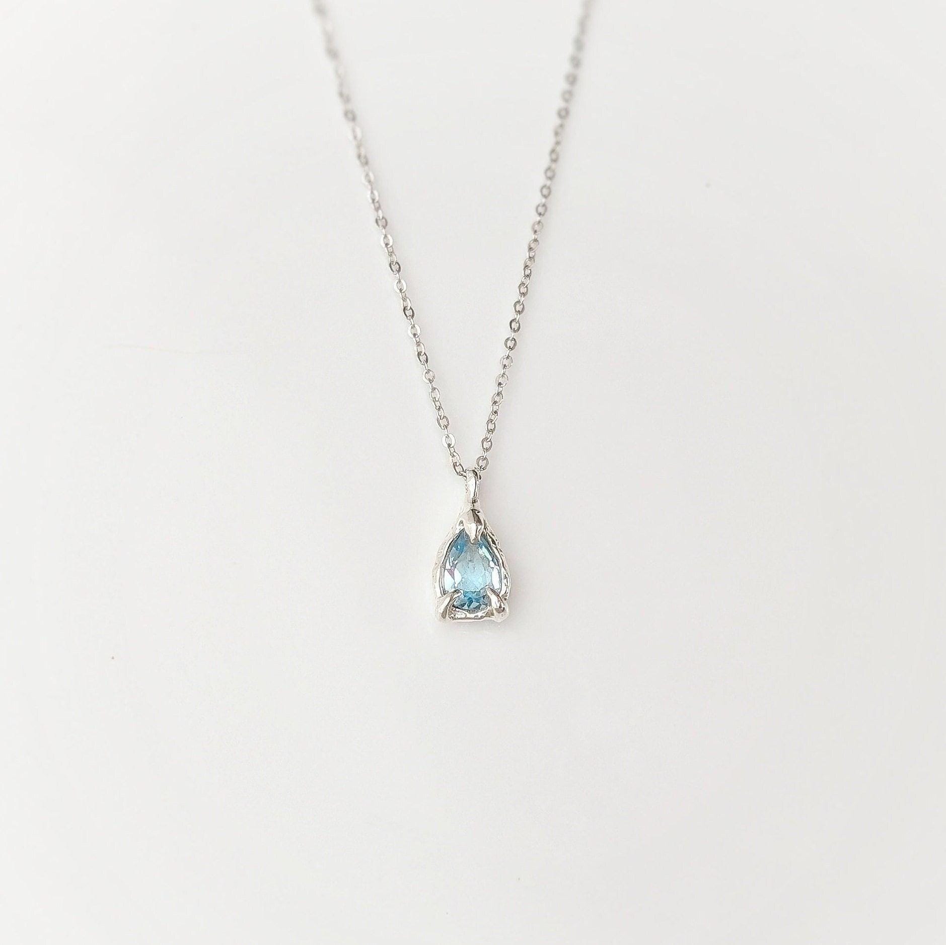 A Pear shape natural Aquamarine pendant set on a Sterling Silver chain