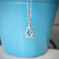A Pear shape natural Aquamarine pendant set on a Sterling Silver chain