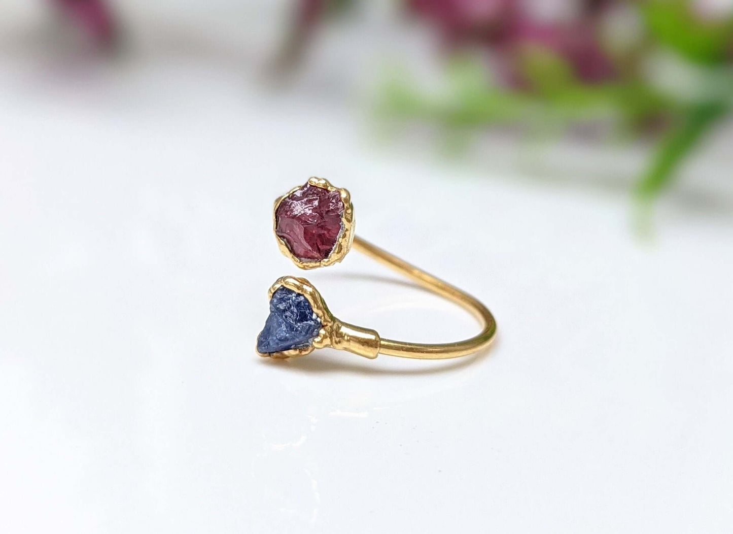 Toi et Moi raw gemstone ring featuring a red and blue gemstone on a gold band, perfect for modern love and friendship.