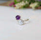 Toi et Moi raw gemstone ring featuring a purple and white gemstone set in a silver band, symbolizing love and family.