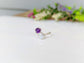 Toi et Moi raw gemstone ring featuring a purple and a clear stone, perfect for family birthstone personalization.