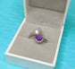 Toi et Moi raw gemstone ring featuring purple and white stones, displayed in a jewelry box.