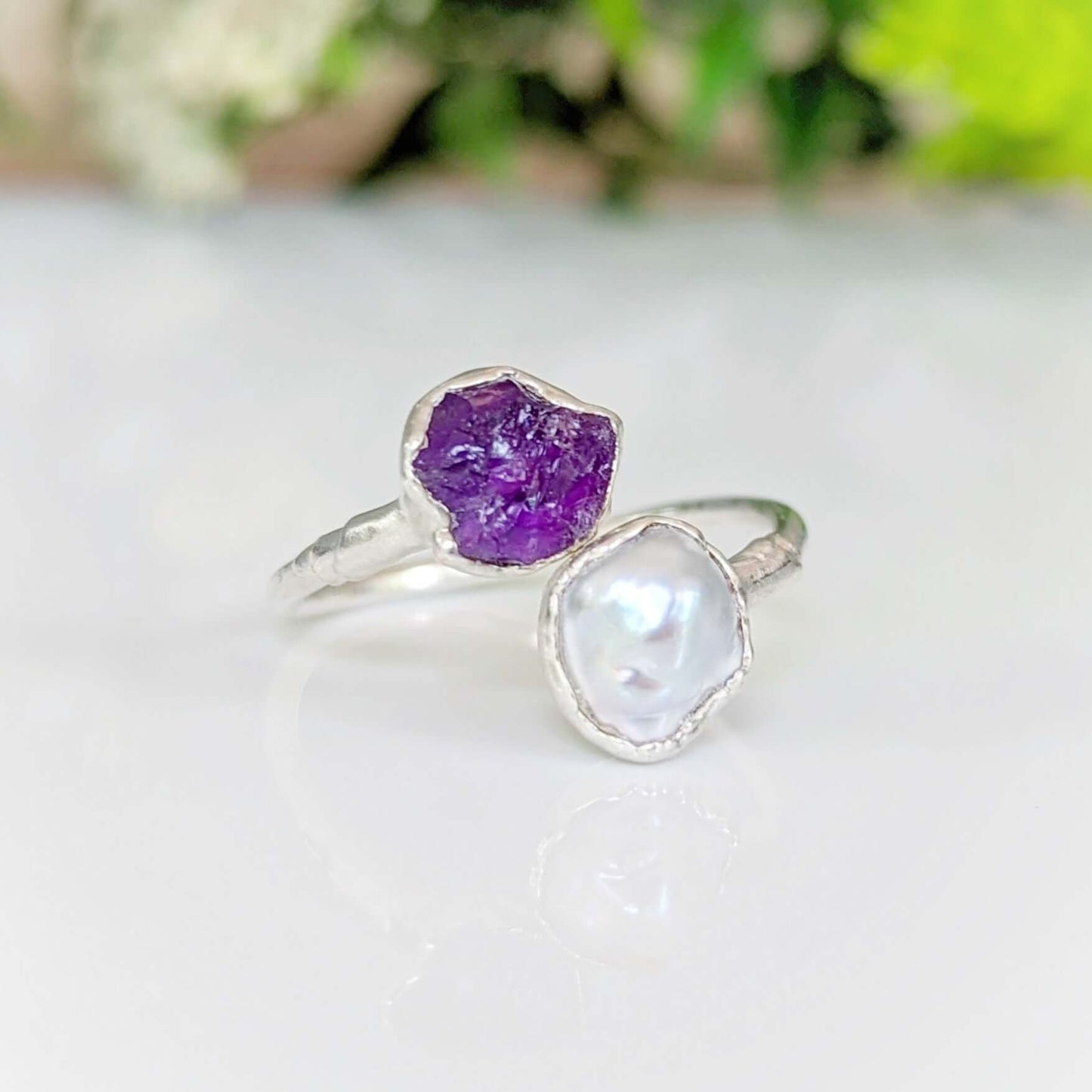 Toi et Moi raw gemstone ring featuring purple raw stone and lustrous pearl, perfect for birthstone celebrations.
