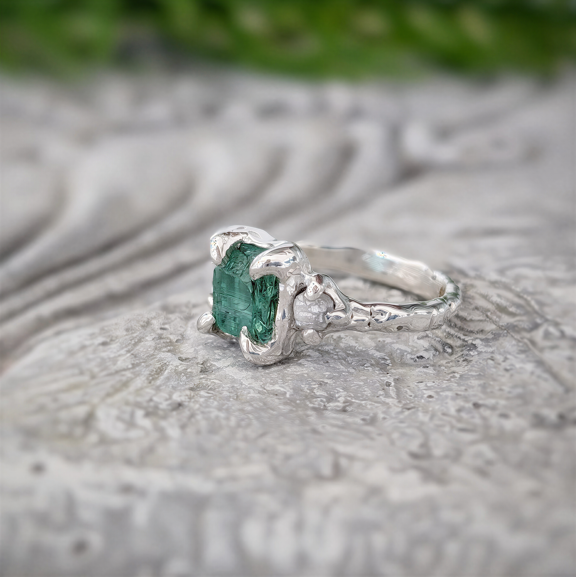 Raw emerald and diamond engagement ring in solid 14k gold, showcasing a unique mint green raw emerald.