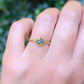 Teal Australian Sapphire ring in solid 14k gold, showcasing unique pod design on textured band.