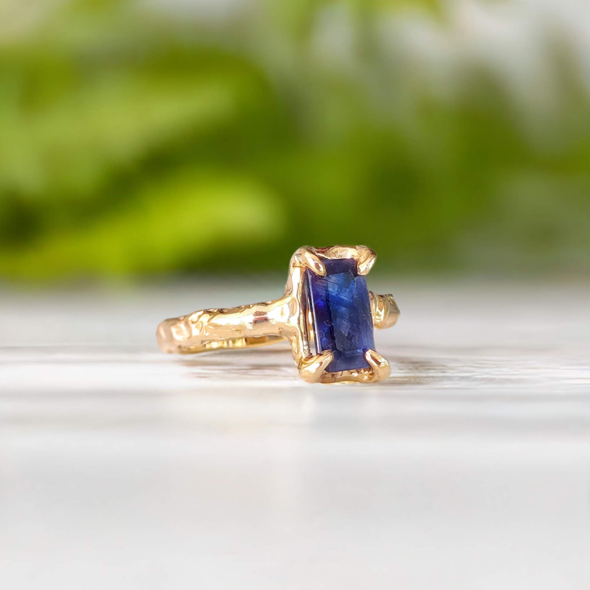 Blue Sapphire engagement ring in solid sterling silver with organic texture and emerald-cut design.