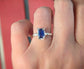 Beautiful blue Sapphire engagement ring in Solid Sterling Silver, showcasing its unique emerald-cut design.