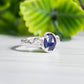 Blue Sapphire and raw diamond engagement ring in solid sterling silver with a textured finish.