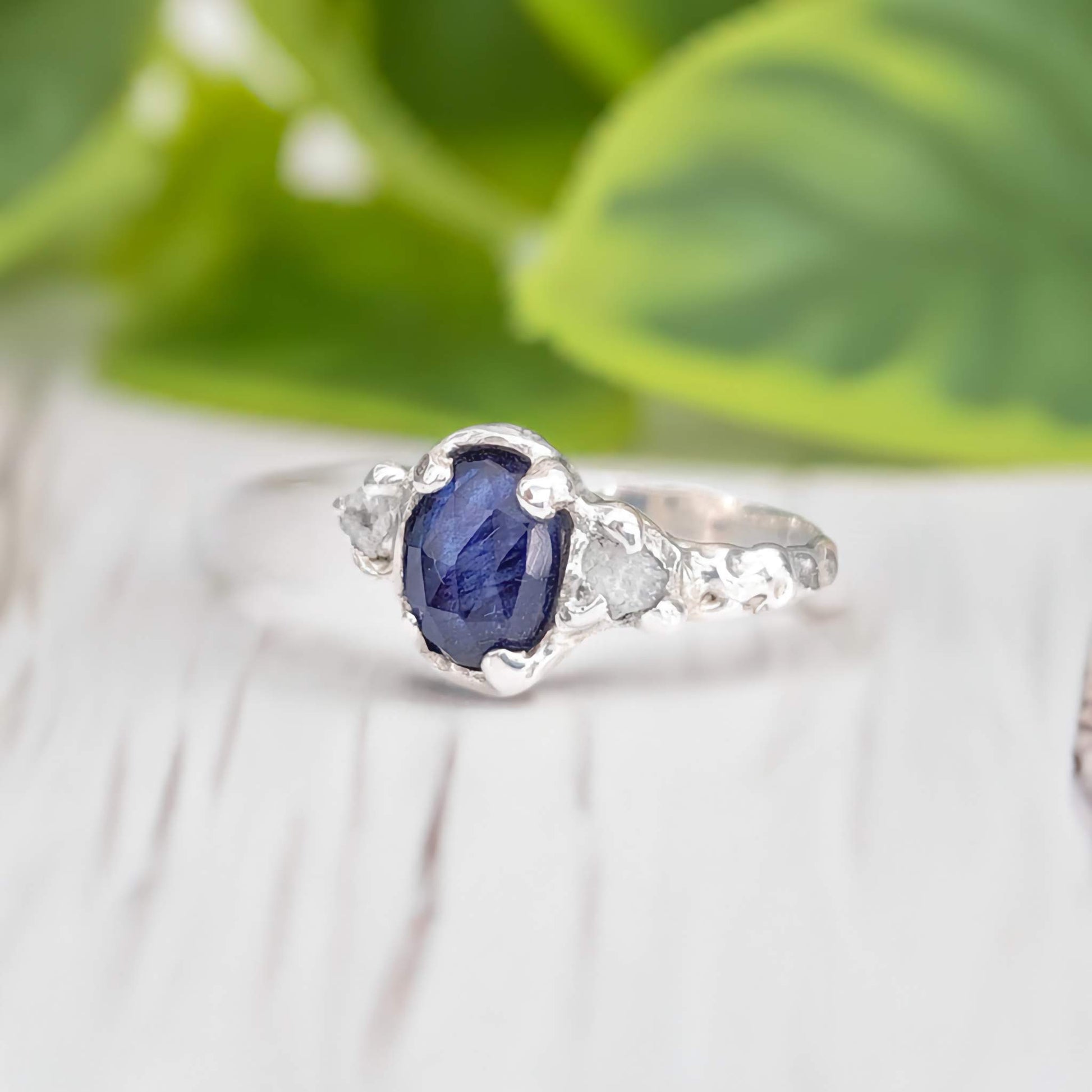Blue Sapphire and raw diamond engagement ring in solid sterling silver, nature-inspired design, showcasing elegance.