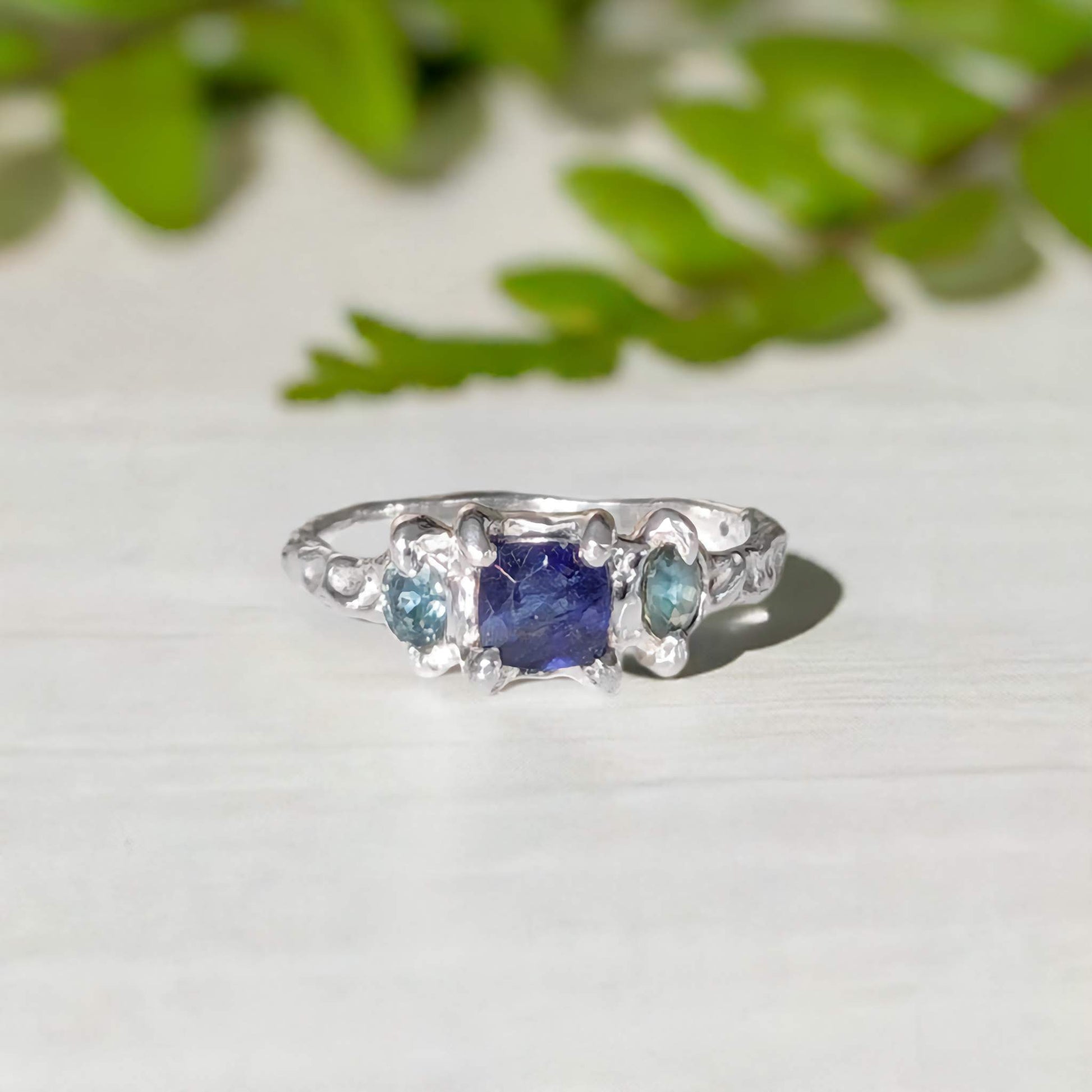 Elegant Blue Sapphire and Tourmaline engagement ring in Solid Sterling Silver, featuring a textured organic design.