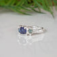 Elegant Blue Sapphire and Tourmaline engagement ring in solid sterling silver with organic design.