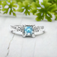 Handcrafted London Blue Topaz engagement ring in sterling silver with unique textured band.