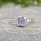 Dainty natural Tanzanite ring with a textured sterling silver band, showcasing a unique purple gemstone.