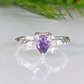 Handcrafted amethyst engagement ring in solid sterling silver with organic textured band.