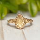 Handcrafted solid 14k gold citrine ring with pear-shaped yellow crystal, perfect for engagements or November birthdays.