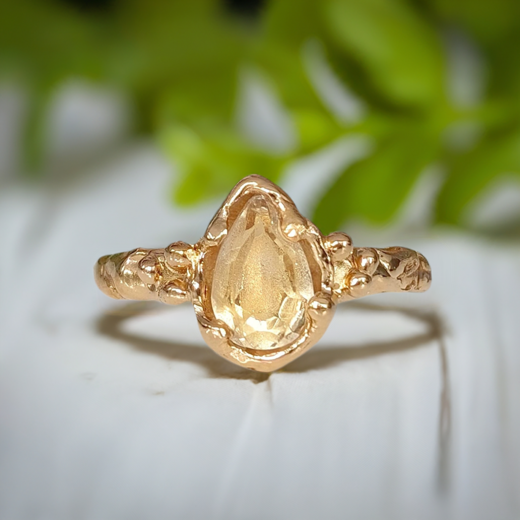 Handcrafted pear shape Citrine ring in solid 14k gold with textured band, showcasing natural charm and elegance.