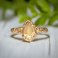 Handcrafted pear shape Citrine ring in solid 14k gold with textured band, showcasing natural charm and elegance.
