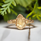 Handcrafted citrine ring in solid 14k gold with a pear-shaped gemstone and textured band, perfect for engagement.