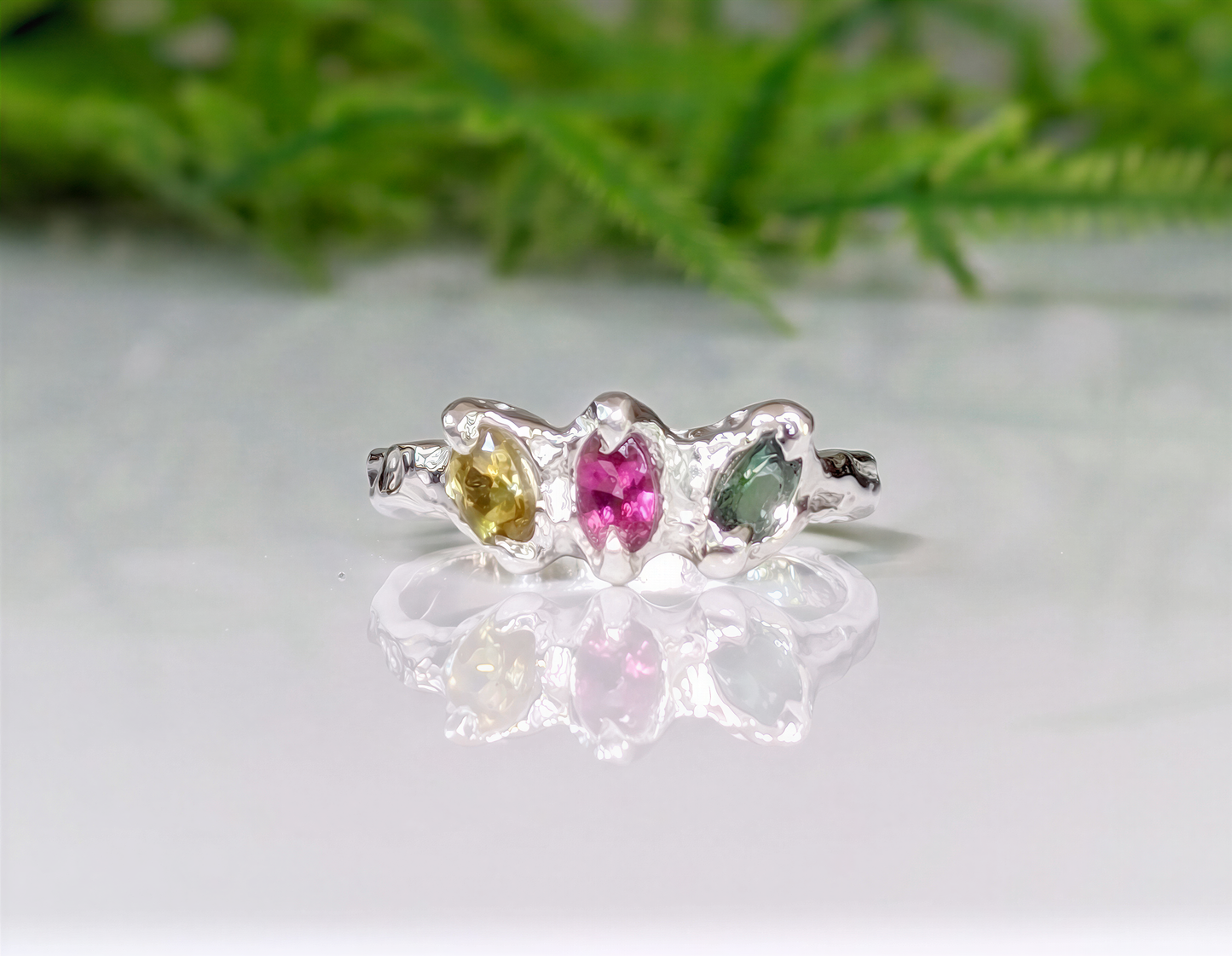 Natural multi Tourmaline sterling silver ring featuring three colorful gems in an organic design, reflecting timeless beauty.