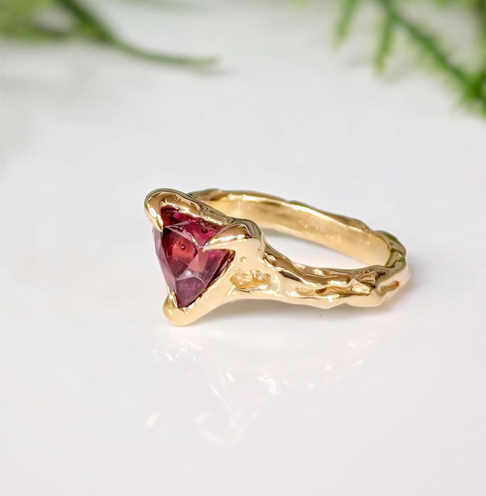 Handcrafted Rubellite Tourmaline ring in solid 14k gold with an organic textured band.