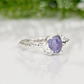 Natural Tanzanite ring in textured silver, featuring a unique organic band and a stunning purple gemstone.