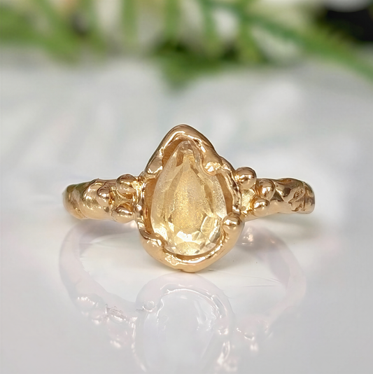 Citrine Engagement Ring with natural pear-shaped golden gemstone and organic molten gold band