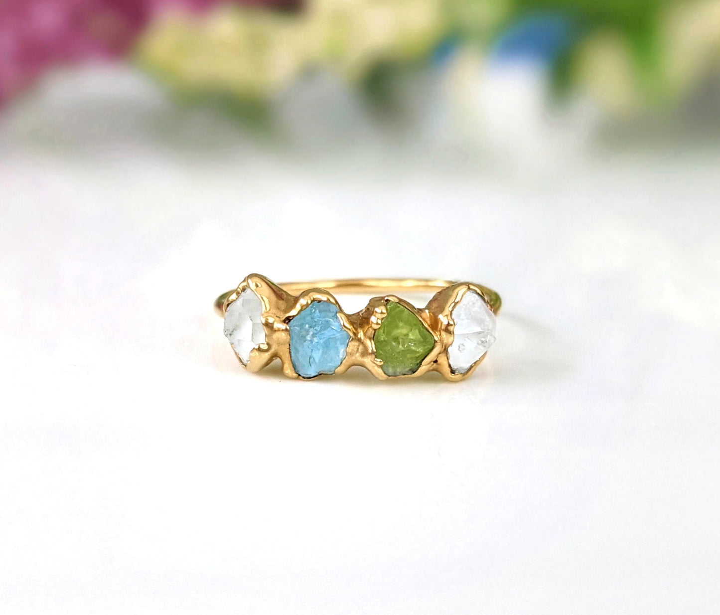 Custom raw gemstone Mother's ring in gold featuring family birthstones, a unique heirloom gift.