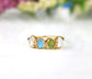 Custom raw gemstone Mother's ring in gold featuring family birthstones, a unique heirloom gift.