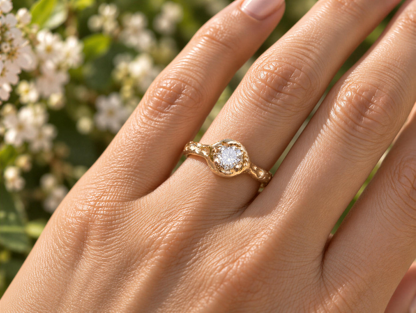 A close-up of a gold ring with a diamond set in the center, worn on a person's hand.