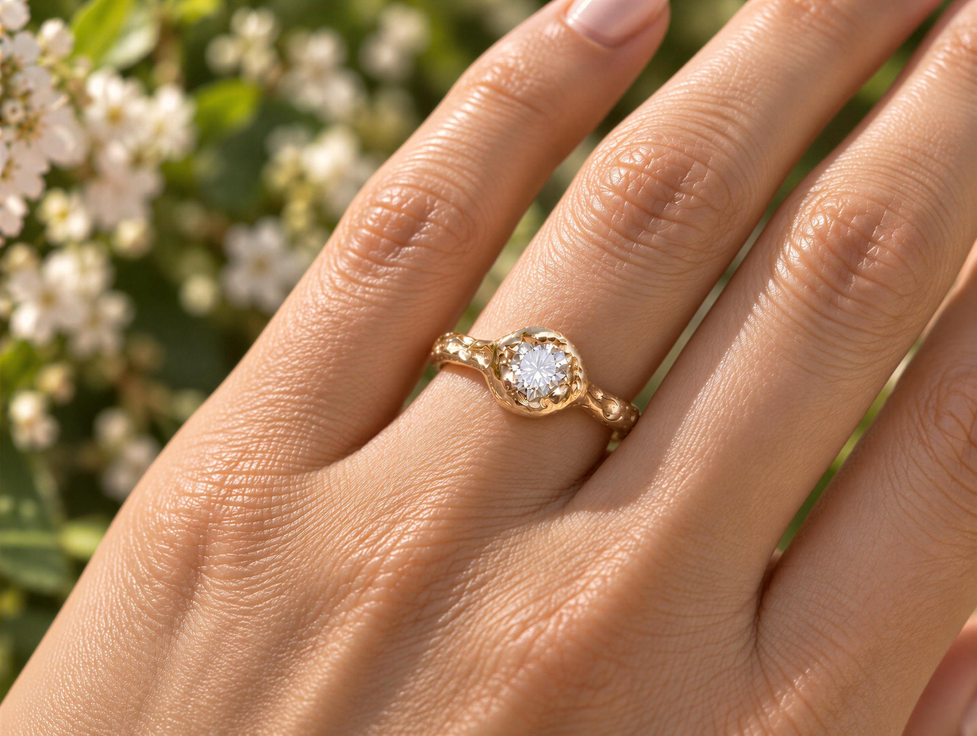 A close-up of a gold ring with a diamond set in the center, worn on a person's hand.