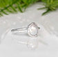 Classic freshwater pearl ring featuring a creamy-white Keshi pearl on a sterling silver band.