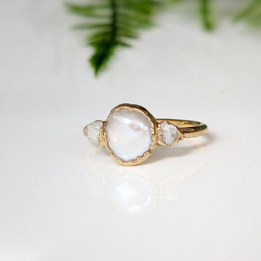 Freshwater pearl engagement ring with raw diamonds, romantic and rustic design, crafted in gold.