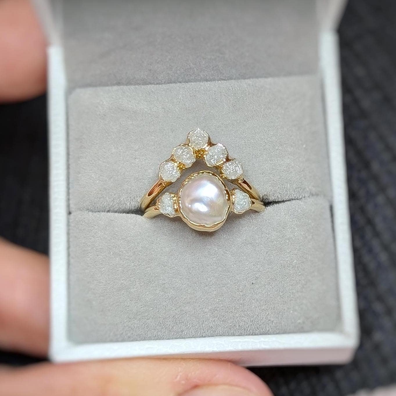 Freshwater pearl and raw diamond engagement ring set in gold, featuring Keshi pearl and rustic diamonds.