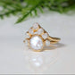 Freshwater pearl ring with raw diamond accents, set in gold, perfect for weddings or unique engagements.