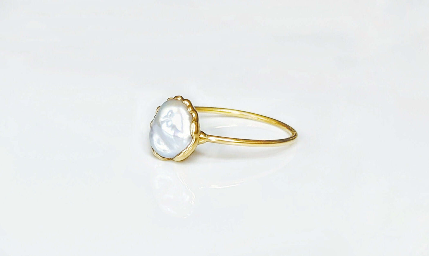 Classic Freshwater pearl ring with golden band, handcrafted June birthstone jewelry for special occasions.