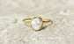 Handcrafted freshwater pearl ring on a stone surface, featuring a unique Keshi pearl and gold band, ideal for special occasions.