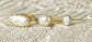 A selection of 3 Solid 14k Gold rings featuring different sizes of Freshwater Pearls
