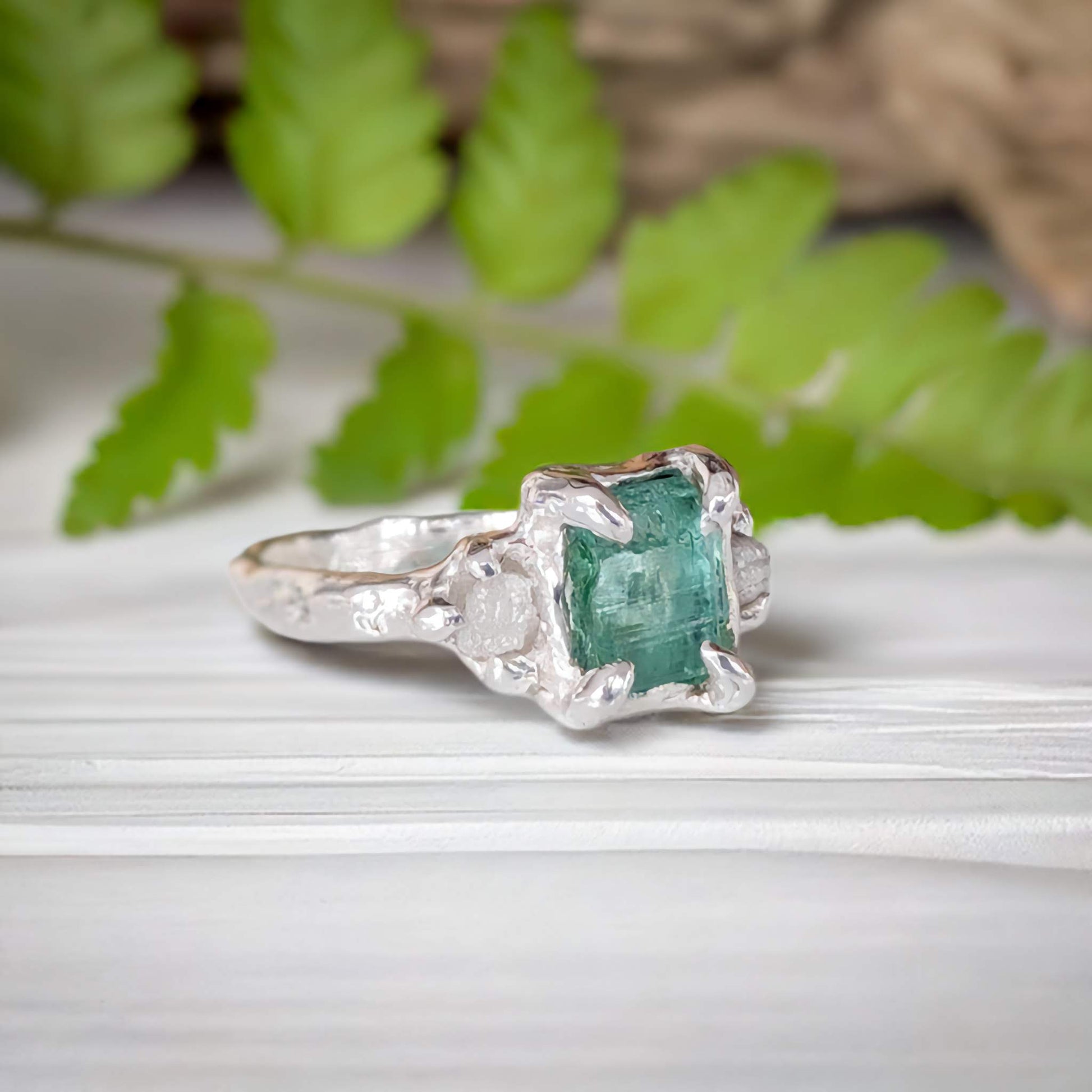 Raw Emerald and diamond engagement ring in Solid Sterling Silver, featuring a mint green Emerald and conflict-free diamonds.