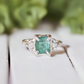 Raw emerald and diamond engagement ring in solid sterling silver with mint green emerald and textured finish.