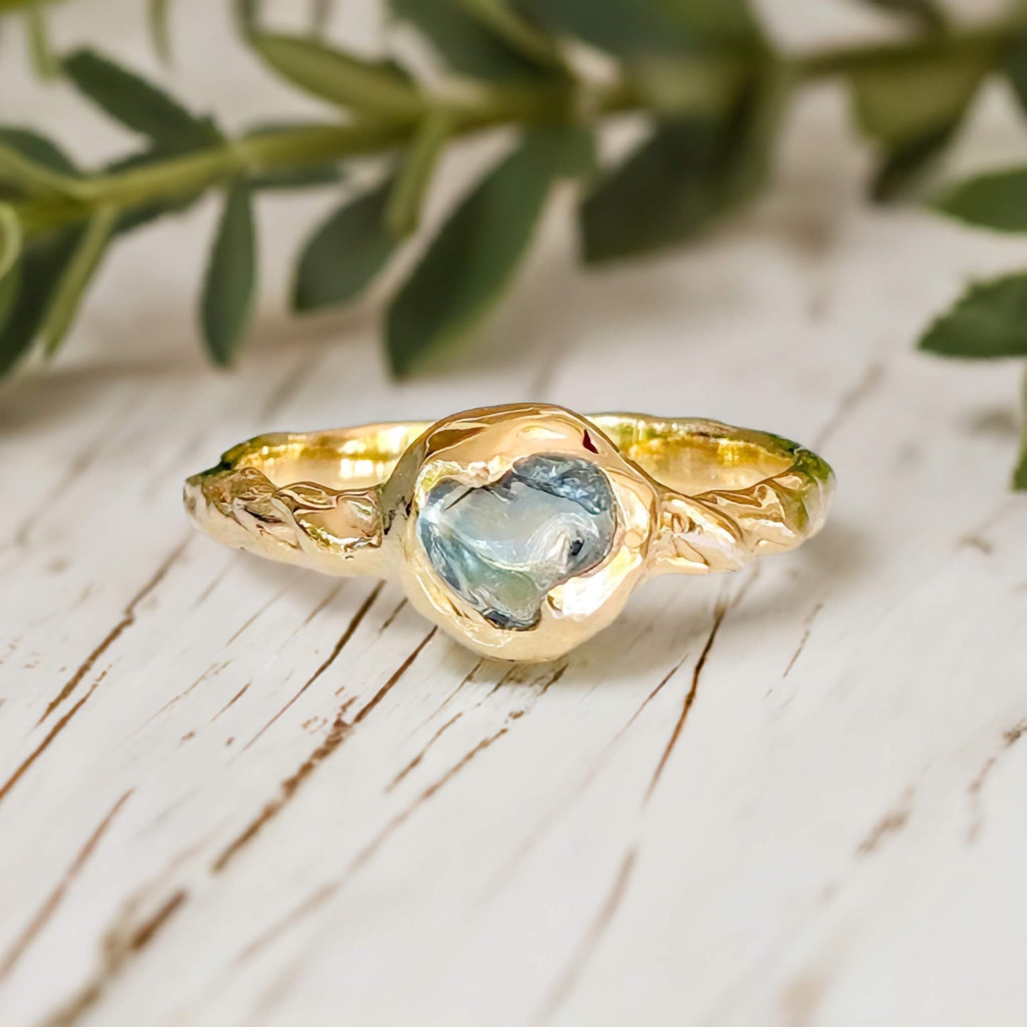 Australian Sapphire ring in solid 14k gold from the 'Pea in a Pod' collection, featuring a unique teal gemstone.