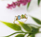 Unique raw gemstone Mother's ring featuring three birthstones set in a gold band, handcrafted heirloom jewelry.