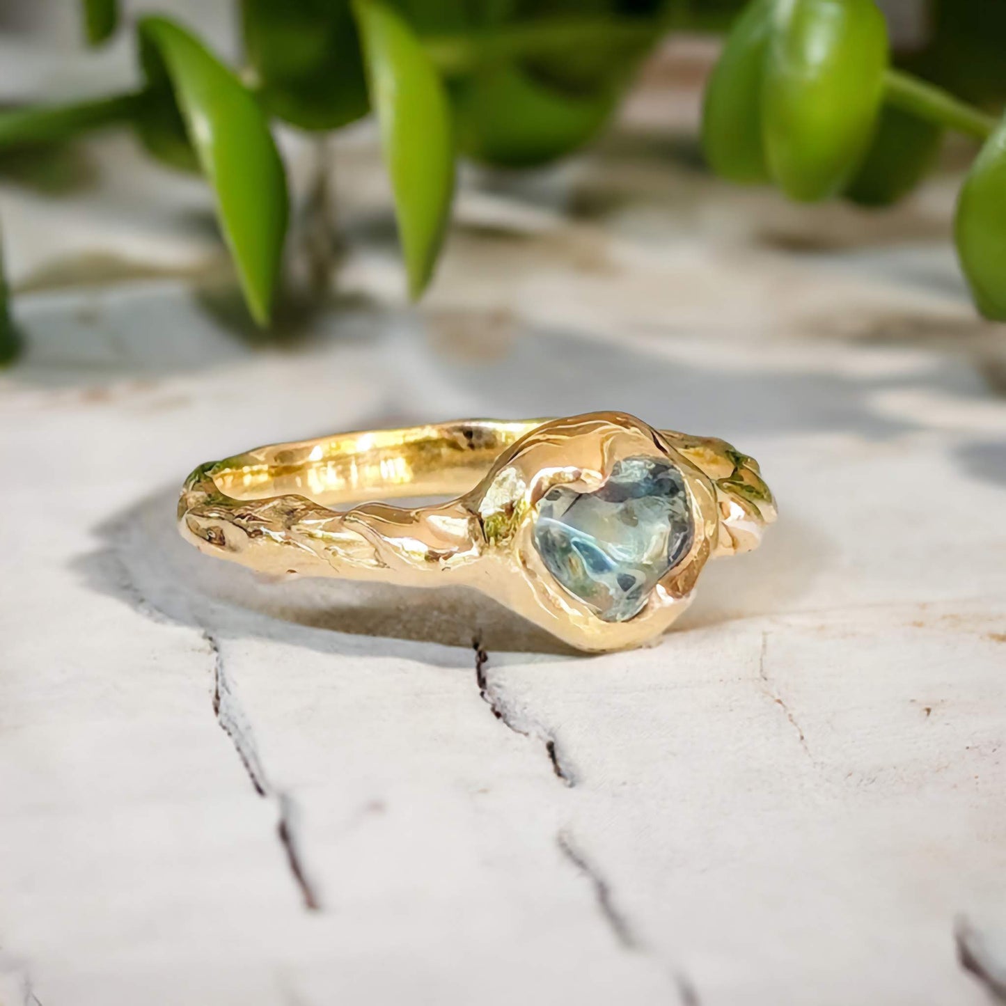 Australian Sapphire ring in solid 14k gold from the Pea in a Pod Collection, featuring a teal color stone on a textured band.